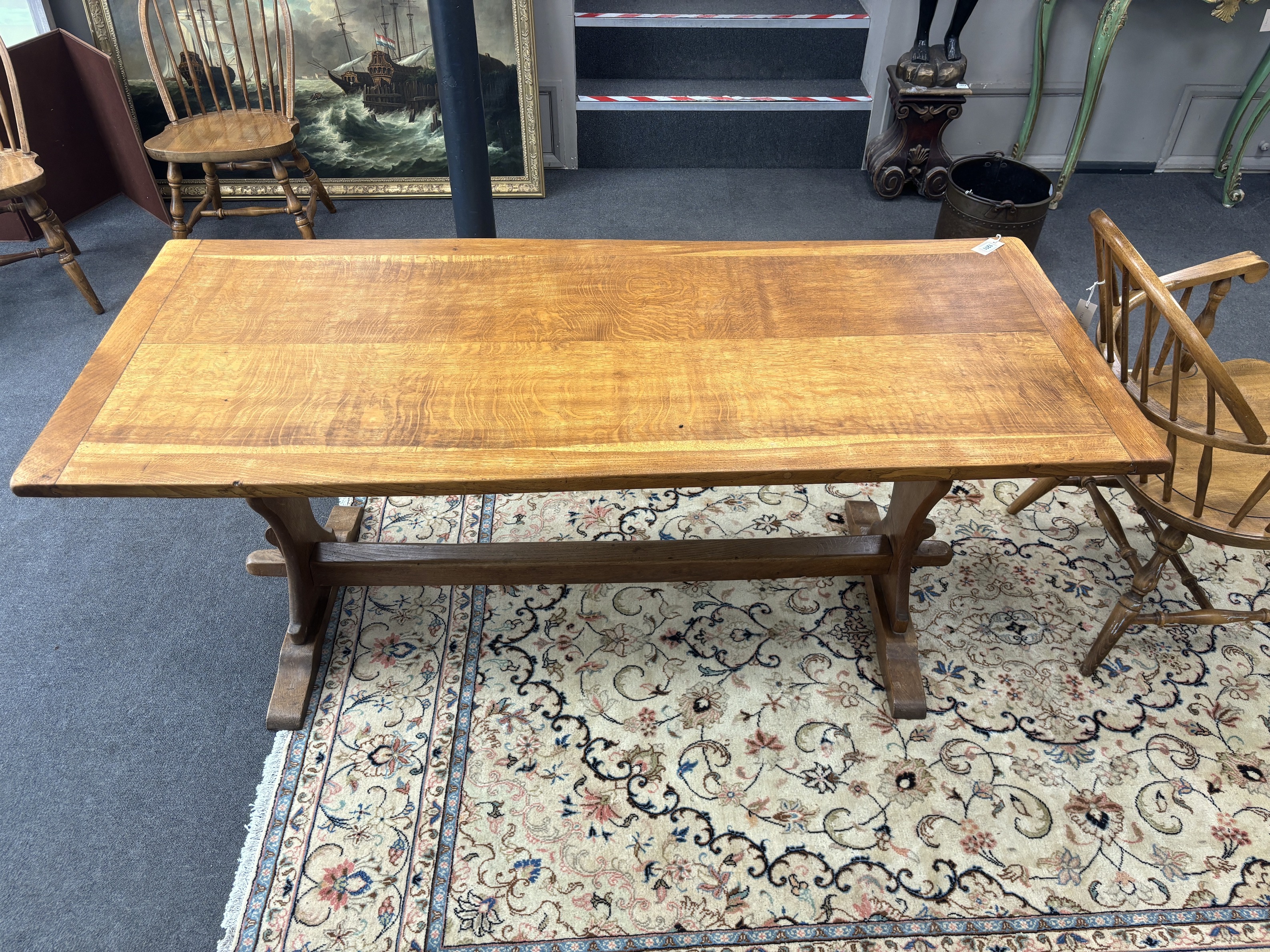 An Arts & Crafts style rectangular oak refectory dining table, width 175cm, depth 73cm, height 73cm